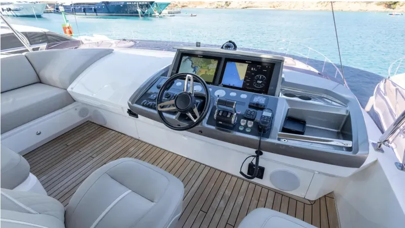  Yacht Photos Pics Luxurious 2022 Princess S66 yacht helm with modern navigation controls and plush seating.