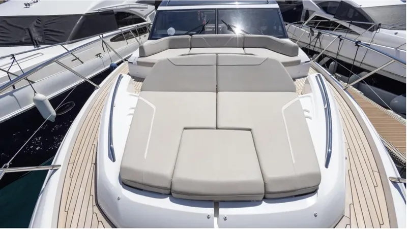  Yacht Photos Pics 2022 Princess S66 yacht with spacious sunbathing area and sleek design.