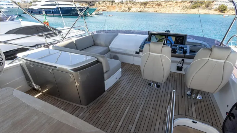  Yacht Photos Pics Luxurious 2022 Princess S66 yacht interior with seating and navigation area.