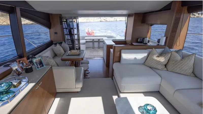  Yacht Photos Pics Luxurious interior of 2022 Princess S66 yacht with elegant seating and ocean view.