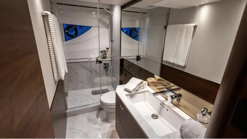  Yacht Photos Pics Luxurious bathroom in 2022 Princess S66 yacht with modern fixtures and elegant design.
