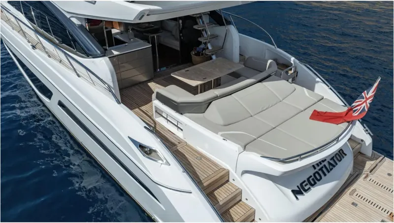  Yacht Photos Pics Luxury 2022 Princess S66 yacht with spacious deck and elegant design on open water.