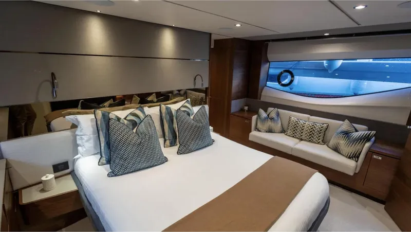  Yacht Photos Pics Luxurious bedroom interior of 2022 Princess S66 yacht with elegant bedding and modern design.