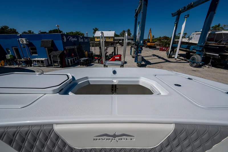  Yacht Photos Pics 2025 Invincible 33 Catamaran at dockyard, showcasing sleek design and spacious deck.