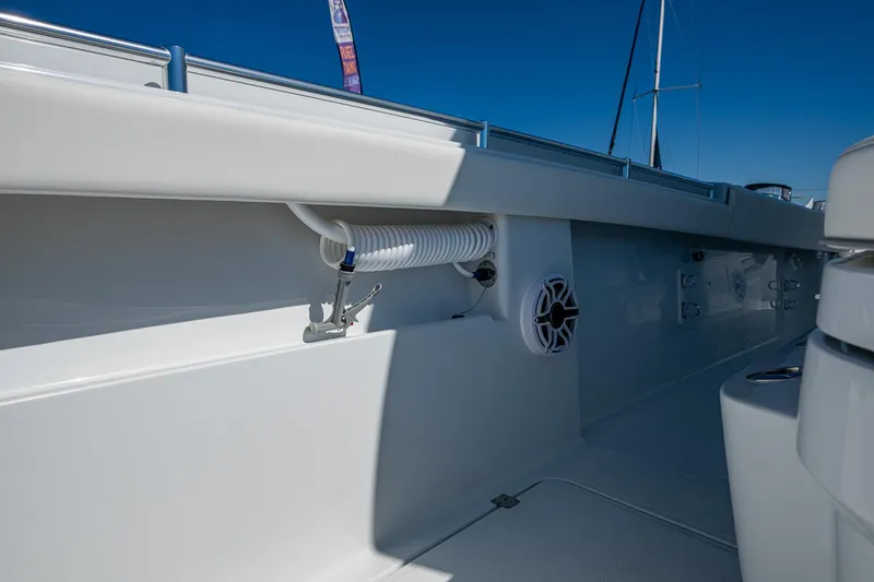  Yacht Photos Pics 2025 Invincible 33 Catamaran interior detail with speaker and hose, showcasing sleek design.