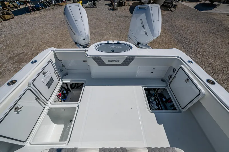  Yacht Photos Pics 2025 Invincible 33 Catamaran with open storage compartments and dual Mercury outboard engines.
