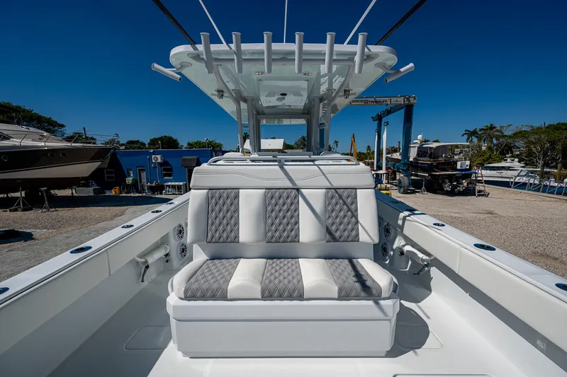  Yacht Photos Pics 2025 Invincible 33 Catamaran with sleek seating and modern design in a marina setting.