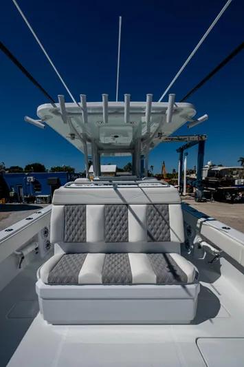  Yacht Photos Pics 2025 Invincible 33 Catamaran with cushioned seating and sleek design.