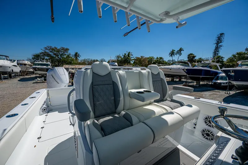  Yacht Photos Pics 2025 Invincible 33 Catamaran interior with luxurious seating and modern design.