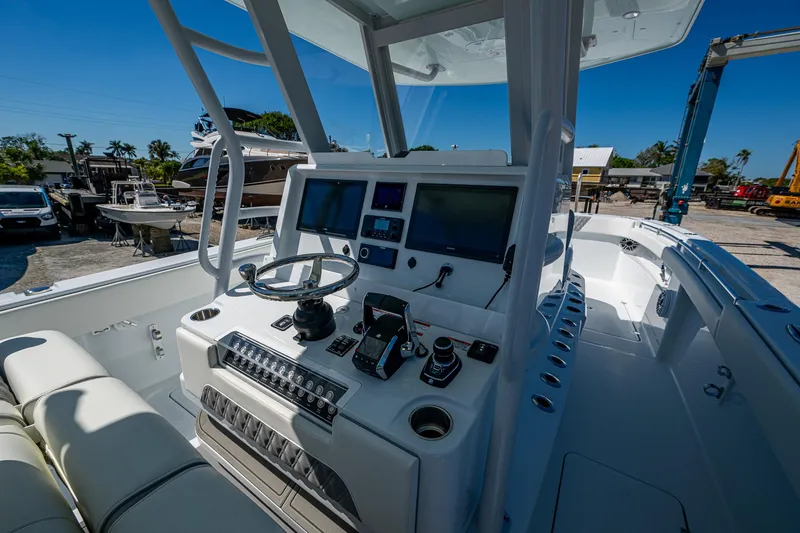  Yacht Photos Pics 2025 Invincible 33 Catamaran cockpit with advanced navigation controls and sleek design.
