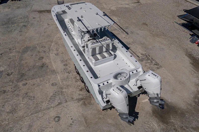  Yacht Photos Pics 2025 Invincible 33 Catamaran with dual engines, aerial view on concrete surface.