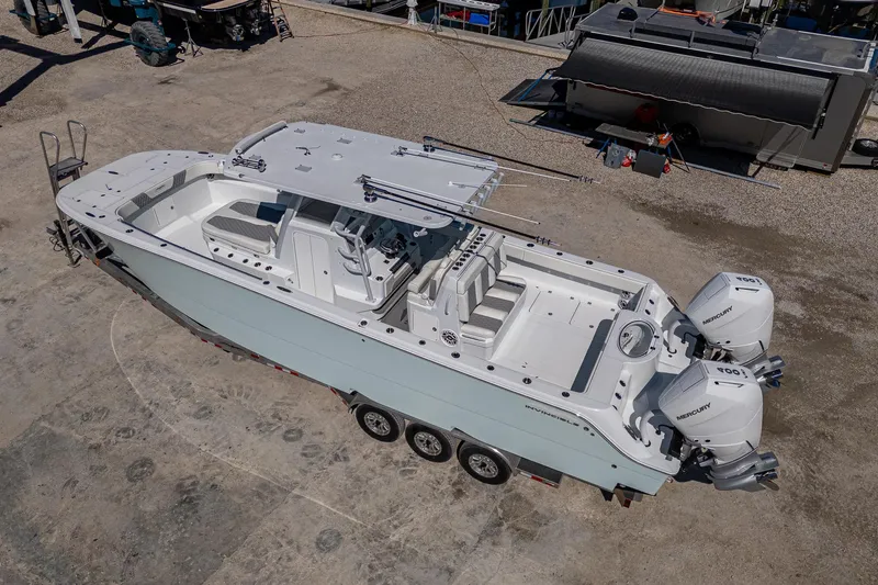  Yacht Photos Pics 2025 Invincible 33 Catamaran with dual engines on a trailer, aerial view.