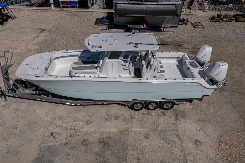  Yacht Photos Pics 2025 Invincible 33 Catamaran on trailer, aerial view, showcasing sleek design and dual engines.