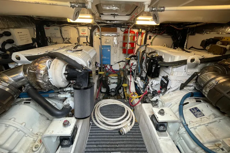 Sasea Yacht Photos Pics Engine room of 2009 Tiara Yachts 4200 Open, showcasing dual engines and equipment.