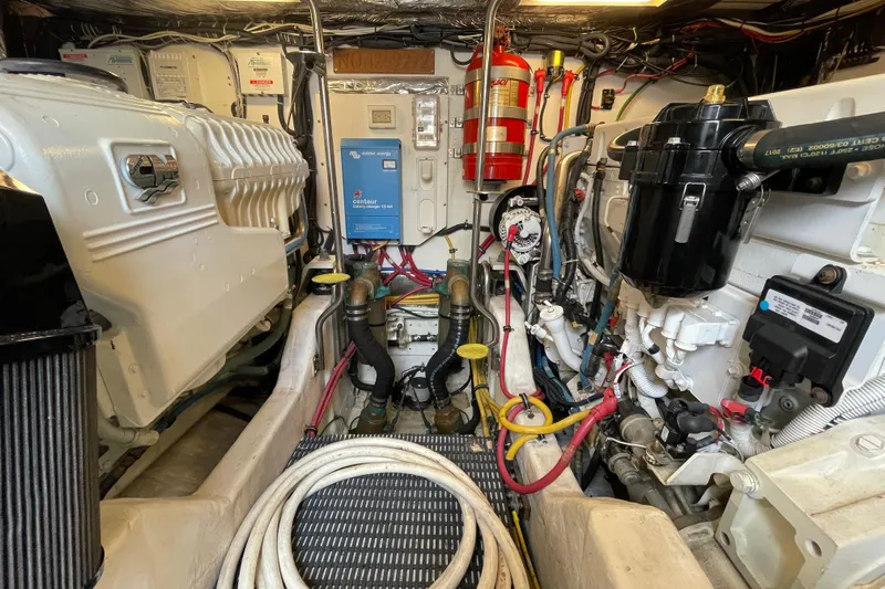 Sasea Yacht Photos Pics Engine room of a 2009 Tiara Yachts 4200 Open, showcasing machinery and equipment.