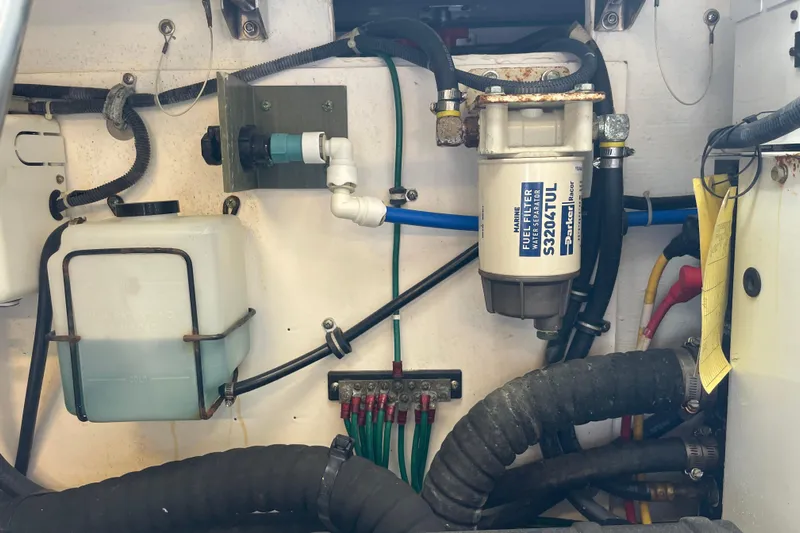 Sasea Yacht Photos Pics Engine compartment of a 2009 Tiara Yachts 4200 Open, featuring fuel filter and wiring.