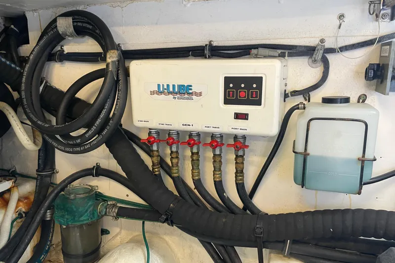 Sasea Yacht Photos Pics Engine room of 2009 Tiara Yachts 4200 Open with U-Lube system and hoses.