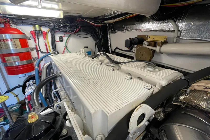 Sasea Yacht Photos Pics Engine room of 2009 Tiara Yachts 4200 Open, featuring a well-maintained engine and fire suppression system.