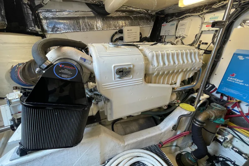 Sasea Yacht Photos Pics Engine room of a 2009 Tiara Yachts 4200 Open, showcasing detailed machinery and components.