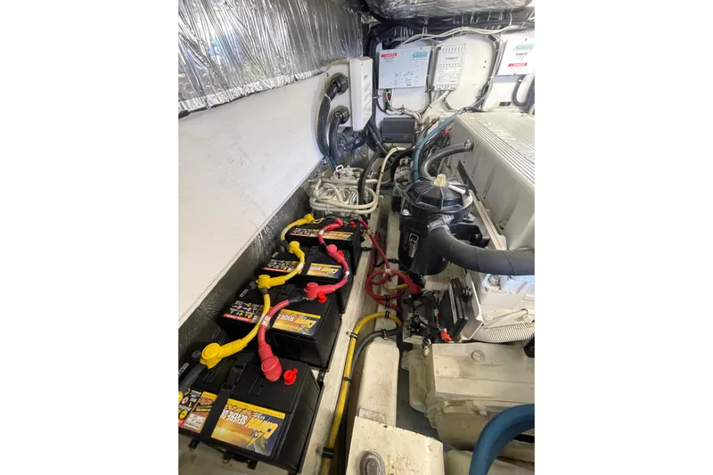 Sasea Yacht Photos Pics Engine room of 2009 Tiara Yachts 4200 Open, featuring batteries and wiring.