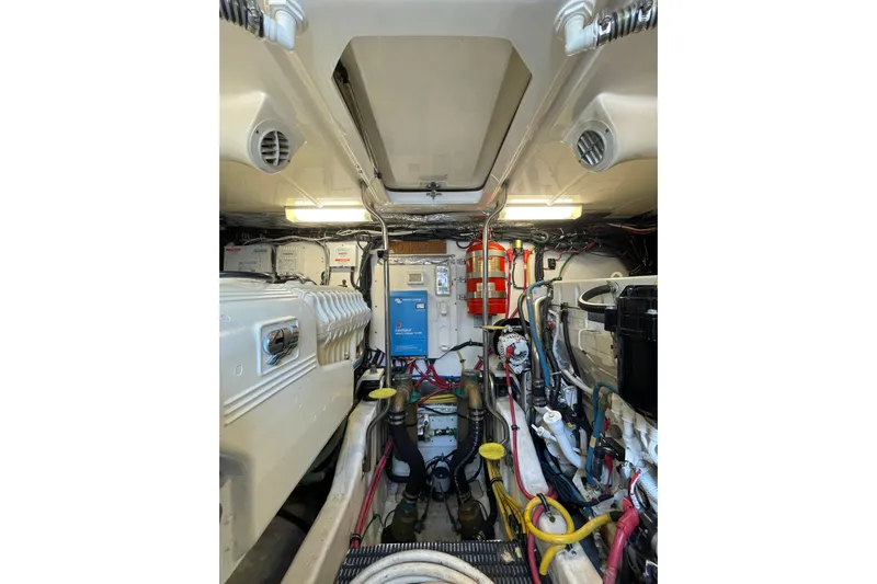 Sasea Yacht Photos Pics Engine room of 2009 Tiara Yachts 4200 Open, showcasing mechanical components and wiring.