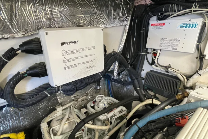 Sasea Yacht Photos Pics Engine room of 2009 Tiara Yachts 4200 Open, featuring electrical components and wiring.