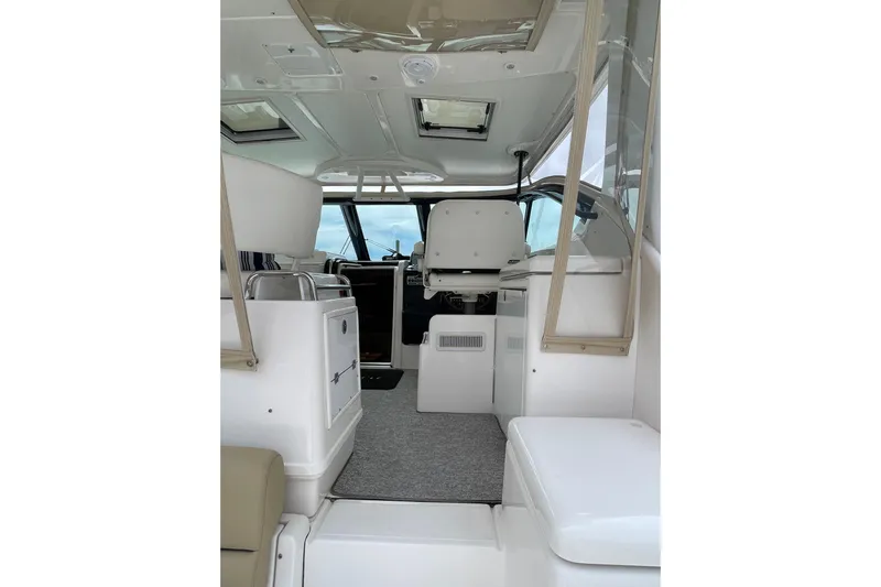 Sasea Yacht Photos Pics Interior view of 2009 Tiara Yachts 4200 Open, featuring helm and seating area.