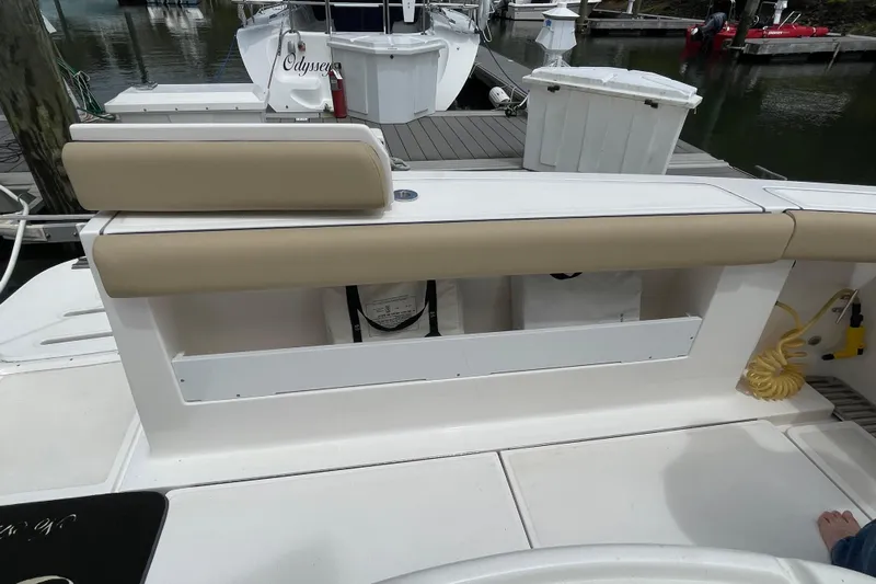 Sasea Yacht Photos Pics 2009 Tiara Yachts 4200 Open boat deck with beige seating at marina.