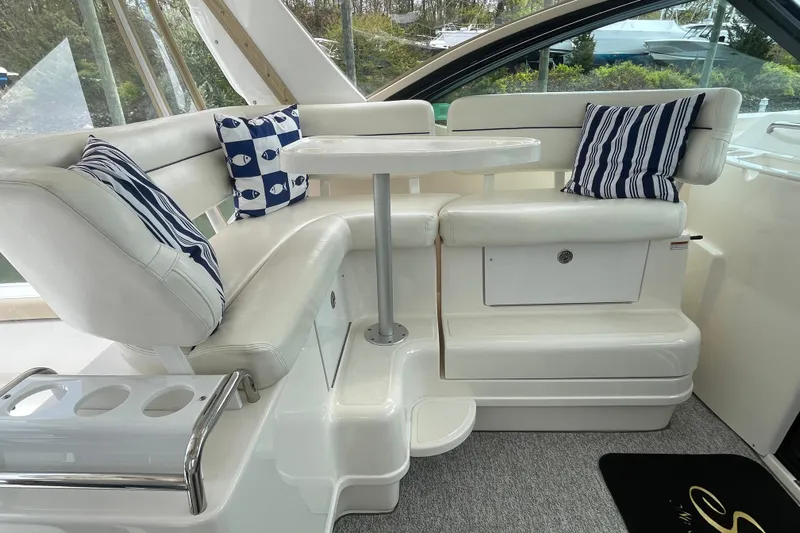 Sasea Yacht Photos Pics Luxurious seating area on 2009 Tiara Yachts 4200 Open with nautical-themed cushions.