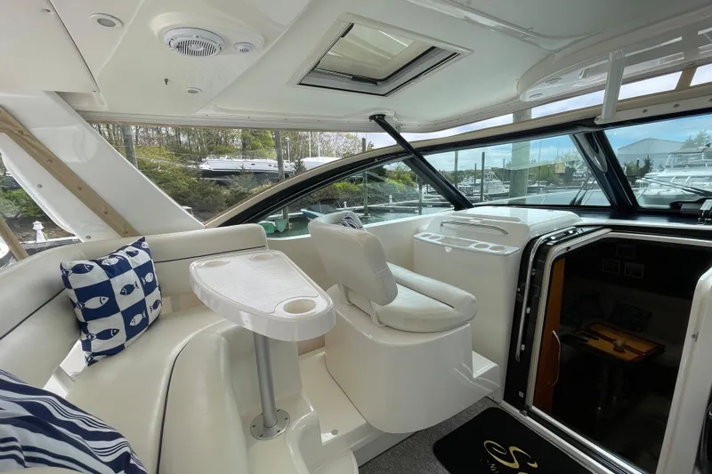 Sasea Yacht Photos Pics 2009 Tiara Yachts 4200 Open interior with seating, table, and helm station.