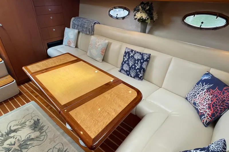 Sasea Yacht Photos Pics Luxurious interior of 2009 Tiara Yachts 4200 Open with elegant seating and decorative pillows.