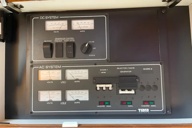 Sasea Yacht Photos Pics Electrical control panel of a 2009 Tiara Yachts 4200 Open, featuring DC and AC systems.