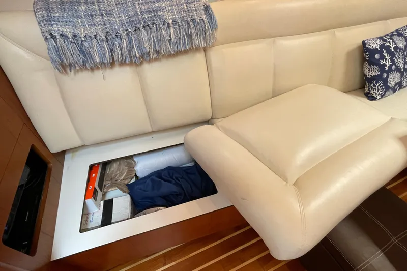 Sasea Yacht Photos Pics 2009 Tiara Yachts 4200 Open interior storage under cream leather seating.