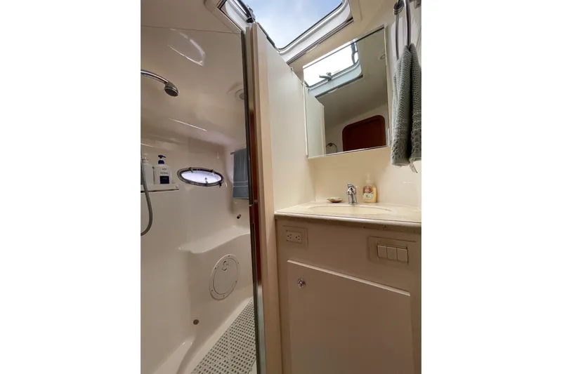 Sasea Yacht Photos Pics Bathroom interior of 2009 Tiara Yachts 4200 Open, featuring shower and vanity.