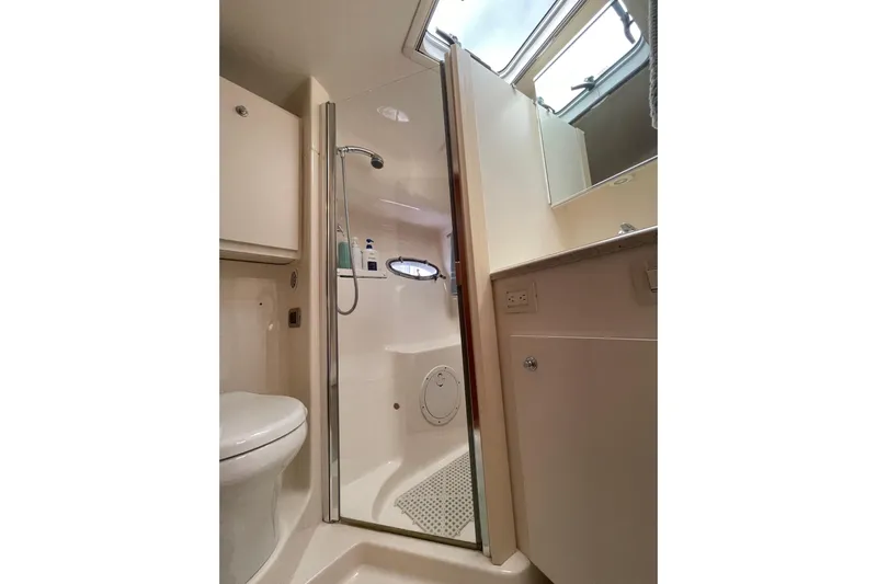 Sasea Yacht Photos Pics Bathroom interior of 2009 Tiara Yachts 4200 Open, featuring shower and toilet.