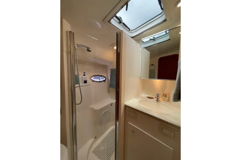 Sasea Yacht Photos Pics Luxurious bathroom in 2009 Tiara Yachts 4200 Open, featuring shower and vanity.