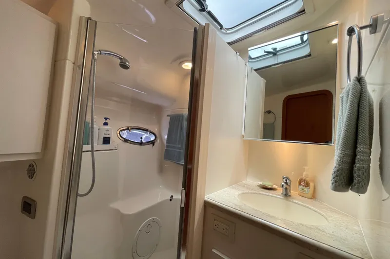 Sasea Yacht Photos Pics Luxurious bathroom in 2009 Tiara Yachts 4200 Open, featuring shower and vanity.