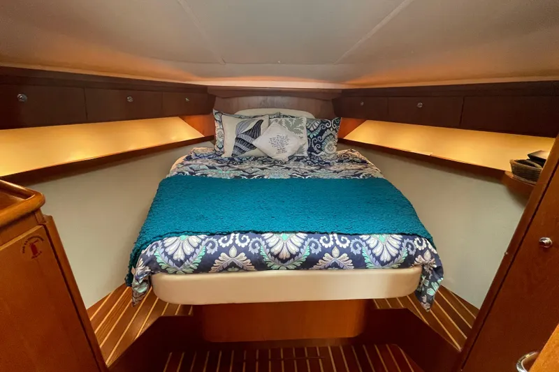 Sasea Yacht Photos Pics Luxurious cabin interior of 2009 Tiara Yachts 4200 Open with cozy bedding.