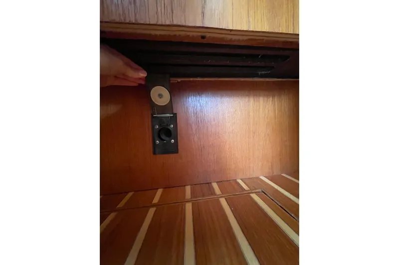 Sasea Yacht Photos Pics Wooden interior detail of a 2009 Tiara Yachts 4200 Open, showcasing a hidden compartment.