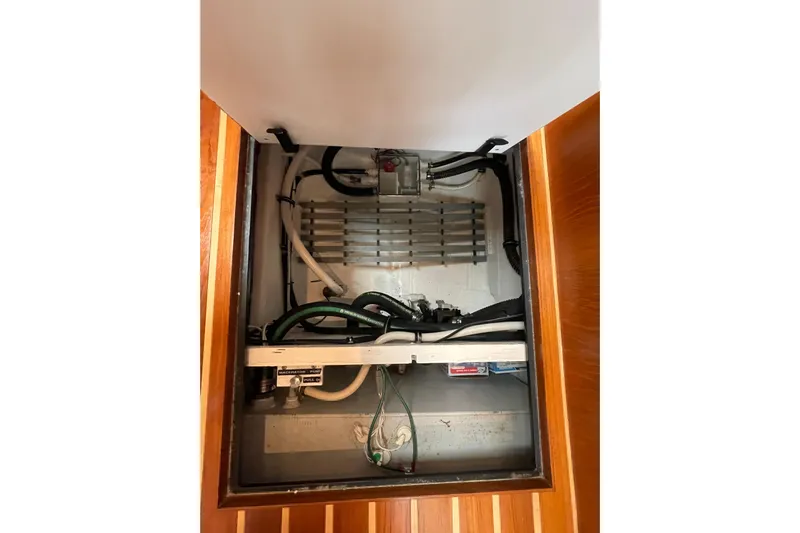 Sasea Yacht Photos Pics Engine compartment of 2009 Tiara Yachts 4200 Open, showcasing mechanical components and wiring.