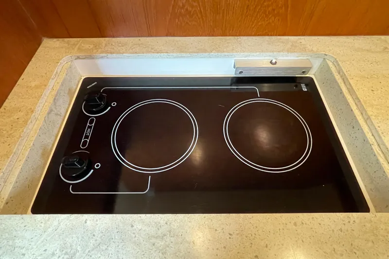 Sasea Yacht Photos Pics Built-in stovetop on 2009 Tiara Yachts 4200 Open, featuring two burners.