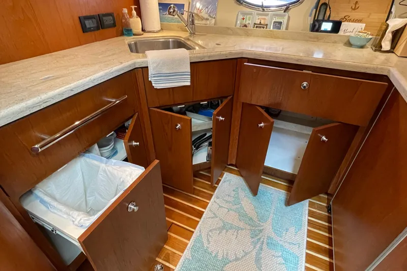 Sasea Yacht Photos Pics 2009 Tiara Yachts 4200 Open galley with wooden cabinets and modern sink.