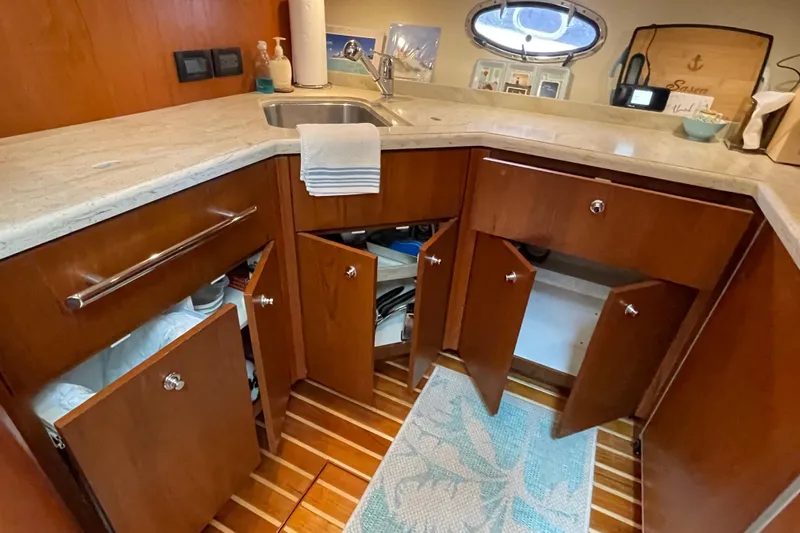 Sasea Yacht Photos Pics 2009 Tiara Yachts 4200 Open galley with wooden cabinets and marble countertop.