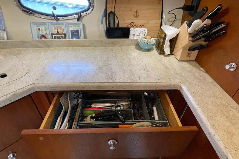 Sasea Yacht Photos Pics 2009 Tiara Yachts 4200 Open kitchen with utensils and knife block on countertop.