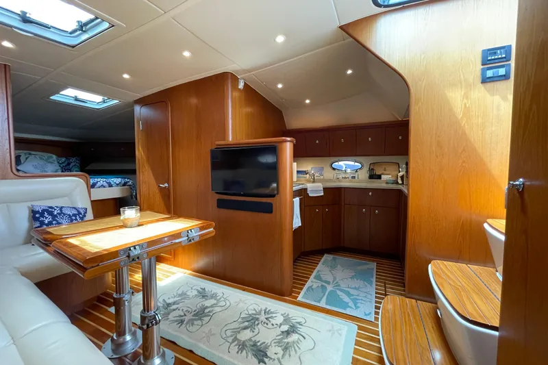Sasea Yacht Photos Pics Luxurious interior of 2009 Tiara Yachts 4200 Open with wood finishes and modern amenities.