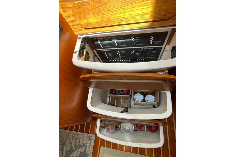 Sasea Yacht Photos Pics 2009 Tiara Yachts 4200 Open interior with control panel and storage compartments.