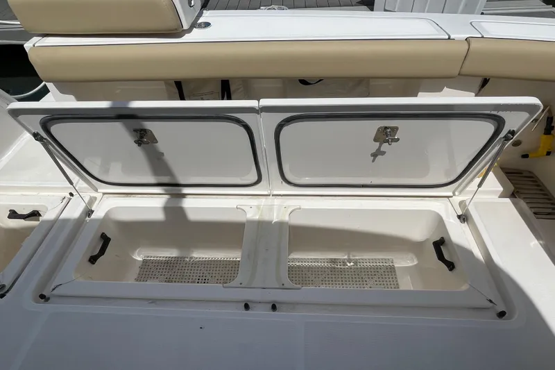 Sasea Yacht Photos Pics Open storage compartments on a 2009 Tiara Yachts 4200 Open boat deck.