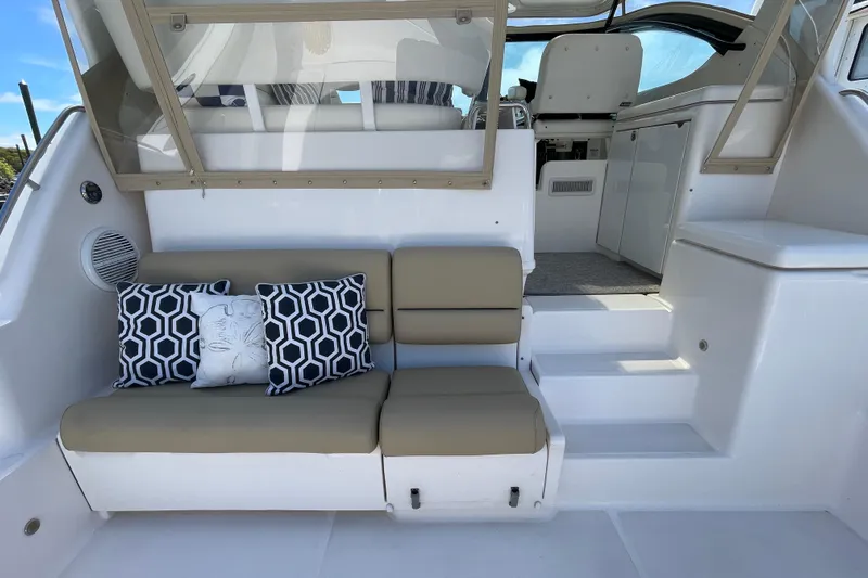 Sasea Yacht Photos Pics 2009 Tiara Yachts 4200 Open interior with cushioned seating and decorative pillows.