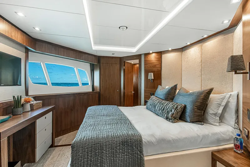 Evereast Yacht Photos Pics Luxurious bedroom interior of 2013 Sunseeker Predator 115 yacht with ocean view.