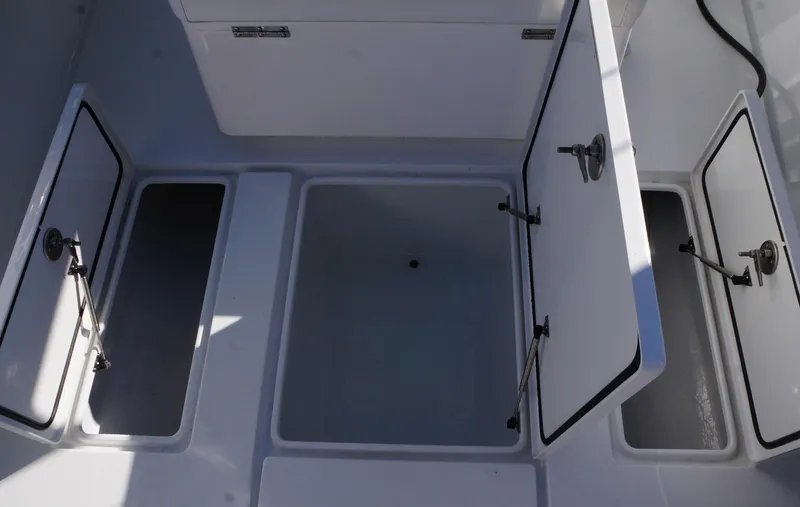  Yacht Photos Pics 2023 Contender 32 ST boat storage compartments open, showcasing spacious interior design.